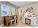 Bright breakfast nook featuring tile floors, a small table, and a charming writing desk near the doorway at 5277 Kingsley Dr, Indianapolis, IN 46220