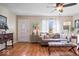 Inviting living room featuring hardwood floors, lots of light, modern decor and furnishings and a decorative front door at 5277 Kingsley Dr, Indianapolis, IN 46220