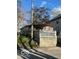 Quaint home featuring a white picket fence and partial brick foundation, nestled on a small lot at 549 N Traub Ave, Indianapolis, IN 46222