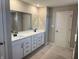 Primary bathroom featuring double vanity, quartz countertops, and modern fixtures at 5692 Coulter Way, Greenwood, IN 46143