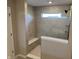 Modern walk-in shower with glass enclosure, built-in bench, and tiled walls at 5692 Coulter Way, Greenwood, IN 46143