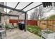 Backyard patio with a pergola, seating, and a grill, perfect for outdoor entertaining at 591 Scotch Pine Dr, Greenwood, IN 46143