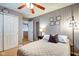 Inviting bedroom features include a ceiling fan, closet, and natural light at 591 Scotch Pine Dr, Greenwood, IN 46143