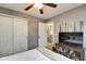 Bright bedroom with a ceiling fan, closet space, and an adjacent room at 591 Scotch Pine Dr, Greenwood, IN 46143