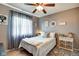 Cozy bedroom with a ceiling fan, soft lighting, and a decorative rug at 591 Scotch Pine Dr, Greenwood, IN 46143