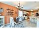 Bright dining area with stylish lighting and view of the kitchen at 591 Scotch Pine Dr, Greenwood, IN 46143