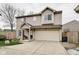 Charming two-story home featuring a two-car garage and a cozy front porch at 591 Scotch Pine Dr, Greenwood, IN 46143