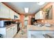 Efficient kitchen layout with white cabinetry, black appliances, and cozy breakfast bar at 591 Scotch Pine Dr, Greenwood, IN 46143