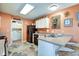 Functional kitchen with black appliances, white cabinetry, and adjacent laundry area at 591 Scotch Pine Dr, Greenwood, IN 46143