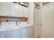 Convenient laundry room with washer, dryer, and additional storage cabinets at 591 Scotch Pine Dr, Greenwood, IN 46143