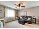 Cozy living room with a ceiling fan, sofa, and window at 591 Scotch Pine Dr, Greenwood, IN 46143