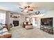 Inviting living room with fireplace, ceiling fan, and plush carpeting at 591 Scotch Pine Dr, Greenwood, IN 46143