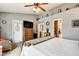 Comfortable main bedroom featuring vaulted ceilings, a ceiling fan, and an attached bathroom at 591 Scotch Pine Dr, Greenwood, IN 46143