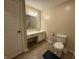Bathroom with a vanity, mirror, toilet, and linoleum flooring at 605 Queenswood Dr, Indianapolis, IN 46217