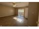 Bedroom with an ceiling fan, doors to the exterior, and neutral walls at 605 Queenswood Dr, Indianapolis, IN 46217