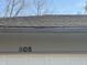 Close-up of the garage with the house number 605 and a shingled roof at 605 Queenswood Dr, Indianapolis, IN 46217