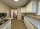 Kitchen with ample counter space, plenty of storage, and a stainless steel sink at 605 Queenswood Dr, Indianapolis, IN 46217