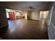 Open-concept living area with hardwood floors, seamlessly flowing into the kitchen, creating a welcoming space at 605 Queenswood Dr, Indianapolis, IN 46217