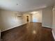 Bright living room with hardwood floors and neutral walls, providing a versatile canvas for personal decoration at 605 Queenswood Dr, Indianapolis, IN 46217