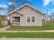 Charming single-story home with well-manicured lawn and inviting front porch at 614 Elm St, Shelbyville, IN 46176