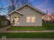 Charming single-story home with well-manicured lawn and inviting front porch at 614 Elm St, Shelbyville, IN 46176