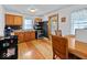 Cozy kitchen with wooden cabinets, stainless steel appliances, and a dining area with natural light at 614 Elm St, Shelbyville, IN 46176
