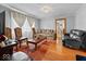 Cozy living room with hardwood floors, natural light, and comfortable seating at 614 Elm St, Shelbyville, IN 46176