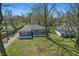 View of home showcasing fenced yard, deck, and roof at 6303 Bertha St, Indianapolis, IN 46241