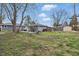 Backyard with swing set, shed, and garage at 6303 Bertha St, Indianapolis, IN 46241
