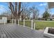 Large gray backyard deck with modern railings, perfect for entertaining and enjoying the outdoors at 6303 Bertha St, Indianapolis, IN 46241