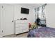 A bedroom with toys, a blue comforter, and a white dresser at 6303 Bertha St, Indianapolis, IN 46241