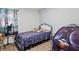 Bright bedroom featuring a comfortable bed and fun decor at 6303 Bertha St, Indianapolis, IN 46241