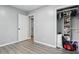 A bright bedroom with open closet space and neutral color palette at 6303 Bertha St, Indianapolis, IN 46241