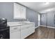 Efficient kitchenette with a functional layout and essential appliances at 6303 Bertha St, Indianapolis, IN 46241