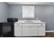 Functional kitchenette with a range and a sink featuring modern cabinetry at 6303 Bertha St, Indianapolis, IN 46241