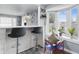 Stylish bar with seating overlooking the outdoor view, complemented by a bright bay window at 6303 Bertha St, Indianapolis, IN 46241