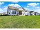 Charming backyard featuring a covered patio and a well-maintained lawn at 6625 Ferguson Dr, Whitestown, IN 46075