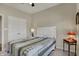 Bedroom featuring a full-size bed with a traditional lamp and closet at 6625 Ferguson Dr, Whitestown, IN 46075
