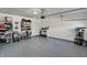 Open garage features ample storage space and epoxy-coated flooring at 6625 Ferguson Dr, Whitestown, IN 46075