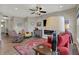 Cozy living room with a fireplace, ceiling fan, comfortable seating, and stylish decor at 6625 Ferguson Dr, Whitestown, IN 46075