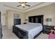 Relaxing main bedroom features stylish black furniture, a large bed, and soft lighting at 6625 Ferguson Dr, Whitestown, IN 46075