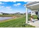Relaxing patio view overlooking a serene pond and lush greenery at 6625 Ferguson Dr, Whitestown, IN 46075