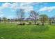 Expansive backyard overlooking a serene pond, perfect for outdoor activities and peaceful views at 7115 N Lyndhurst Xing, McCordsville, IN 46055