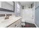 The bathroom features a tub, shower, decorative tile accents, and a single sink vanity at 7115 N Lyndhurst Xing, McCordsville, IN 46055