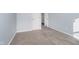 Bedroom featuring neutral walls, carpet, trim, and hall access at 7115 N Lyndhurst Xing, McCordsville, IN 46055