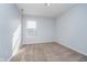 Bright bedroom featuring a window providing natural light and neutral carpet and walls at 7115 N Lyndhurst Xing, McCordsville, IN 46055