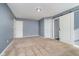 This carpeted bedroom features neutral walls, base trim, and convenient ensuite access at 7115 N Lyndhurst Xing, McCordsville, IN 46055