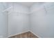Walk-in closet featuring white wire shelving and neutral carpet at 7115 N Lyndhurst Xing, McCordsville, IN 46055