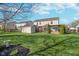 Spacious backyard featuring a shed, pergola, and well-maintained lawn, ideal for outdoor living at 7115 N Lyndhurst Xing, McCordsville, IN 46055
