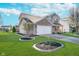 Well-manicured lawn and landscaping highlight this inviting two-story home's exterior at 7115 N Lyndhurst Xing, McCordsville, IN 46055